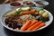 plate of perfectly cooked vegetables and grains, ready for sous-vide slow cooking