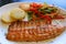 Plate of Peruvian Style Grilled Trout with Vegetable Saute