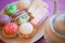 A plate of petits cakes with a cup and a jug.