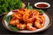 plate of piping hot tiger shrimp prawns with tangy spicy sauce