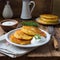 A plate of Polish potato pancakes served with sour cream.