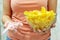 A plate of potato chips and a centimeter tape in the girl`s hands. Junk food. The concept of struggle against excess weight.