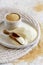 A Plate of raw Amaranth flour with a scoop and a bowl Amaranth seeds