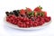 Plate of red summer fruits and berries