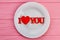 Plate with red text I love you.