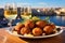 A plate of rustic homemade Maltese arancini balls.