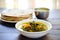 plate of saag aloo beside a stack of chapatis