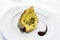 Plate with a slice of Sicilian pistachio panettone