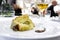 Plate with slice of Sicilian pistachio panettone in restaurant