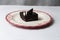 Plate with slice of tasty homemade chocolate cake on table