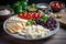 plate of sliced ingredients, ready for cooking: cheese slices, tomatoes, olives and other items