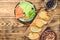 Plate with sliced pieces of red salmon fish, cucumber slices, arugula olives and fried bread