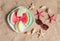 Plate with slices of melon and watermelon , sunglasses, starfishes and seashells on sand beach