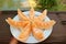 Plate of Slices of Mouthwatering Fresh Cantaloupe Melon on the Garden Wooden Table