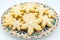 Plate with Snowflake-shaped sugar icing Christmas cookies, white background