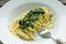 Plate with spaghetti and spinach