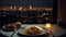 A plate of spaghetti and wine on a table with a view of a city at night in the background with candles and wine glasses on the