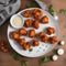 A plate of spicy buffalo cauliflower bites with a side of ranch dressing2