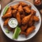 A plate of spicy buffalo chicken wings with celery and ranch dip3