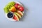 Plate with summer fruits: watermelon, blueberry,apples,pear and grape on white plate.