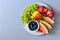 Plate with summer fruits: watermelon, blueberry,apples,pear and grape on white plate. Healthy eating concept. Top view. Copy space