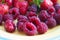 Plate with summer ripe berries - strawberries, strawberries, raspberries. Vitamin delicious simple natural vegan juicy dessert