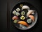 a plate of sushi with chopsticks on a black tablecloth with chopsticks and a lemon on the side of th