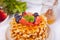 Plate with sweet tasty waffles with honey, berries, cup of tea on the white background