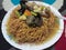 a plate of tamie capcay dishes with a composition of noodles, mushrooms, sweet corn, mustard greens and carrots for my dinner