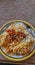 Plate of tasty biryani on table