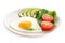 Plate of tasty breakfast with heart shaped fried egg isolated on white