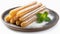 Plate of tasty churros with sugar powder. Traditional Spanish pastry. Delicious dessert