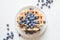 Plate of tasty stacked waffles with blueberries