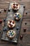 Plate with tasty tartlets on wooden table