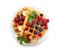 Plate with tasty waffles, fruit and berries on white background