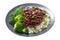 plate of teriyaki beef, rice, broccoli and sesame seeds on white background