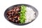 plate of teriyaki beef, rice, green onion and sesame seeds on white background