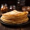 Plate of thin pancakes, close up on a wooden background