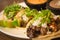 Plate of three street style tacos