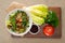 Plate of traditional Arabic salad fattouch on a wooden plate