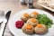 Plate of traditional Passover Pesach gefilte fish on wooden table