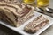 Plate with traditional Turkish chocolate halva and a slice and tea