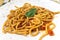 Plate with Tuscan pici pasta with garlic and tomato