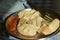 a plate of veg steamed momo with sauce chutney in black background with space for text