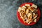 Plate with wafers with caramel on black smokey table