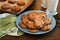 Plate of warm chocolate chip cookies and glass of milk