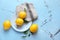 Plate with whole ripe lemons on light table