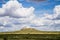 Plateau in Field with Cloudscape