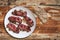 Plateful Of Fried Pork Ham Rashers With Slice Of Integral Brown Bread Set On Old Cracked Wooden Picnic Table