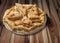 Plateful of Lazy Apple Pie Slices Set On Rustic Knotted Pine Wood Garden Table